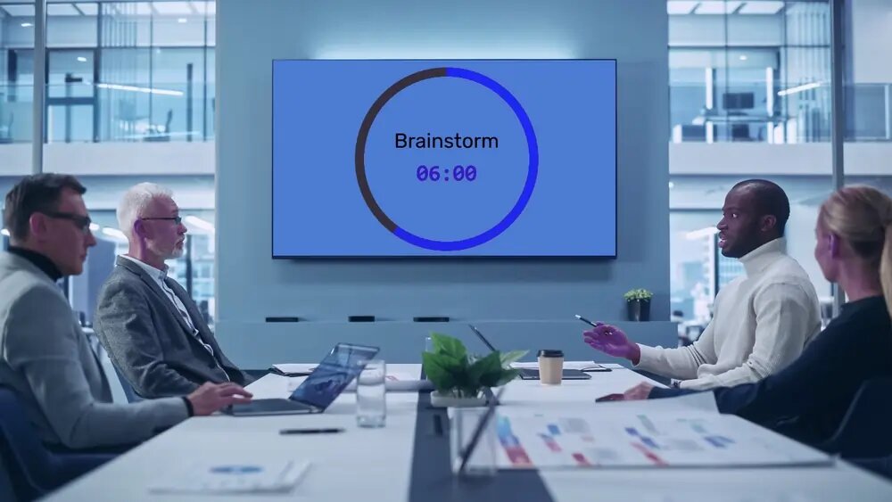Meeting room with a countdown timer on the wall screen