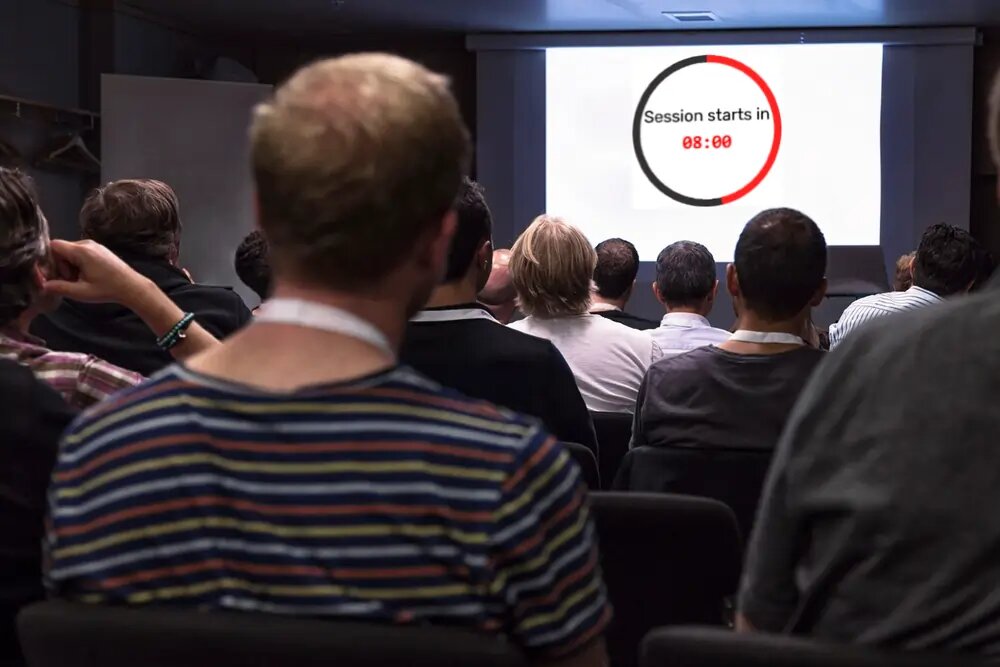 A free presentation timer the speaker, moderator, and tech desk all see at once — control it from the back of the room while it counts down by the stage.