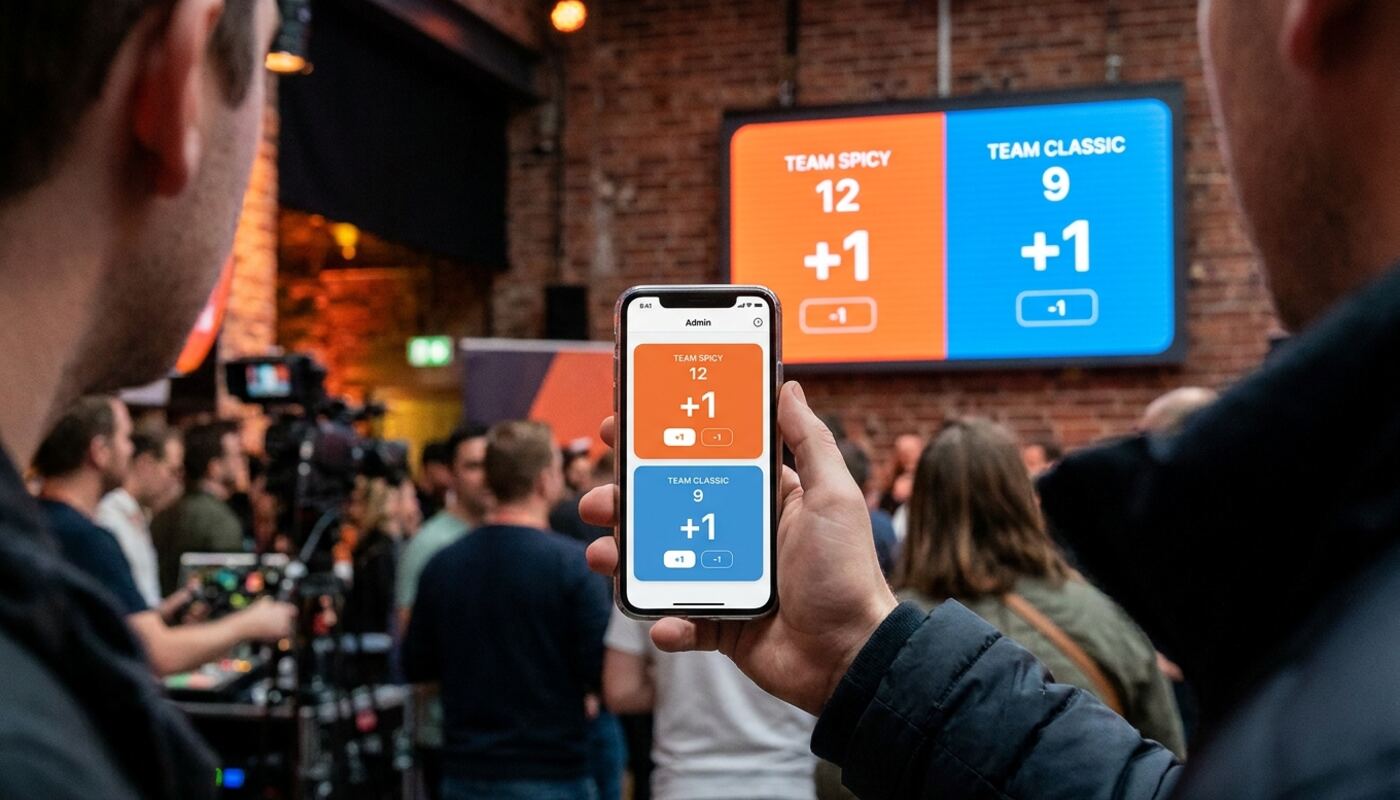 Operator scoring an event from their phone while the venue display shows the same scoreboard live